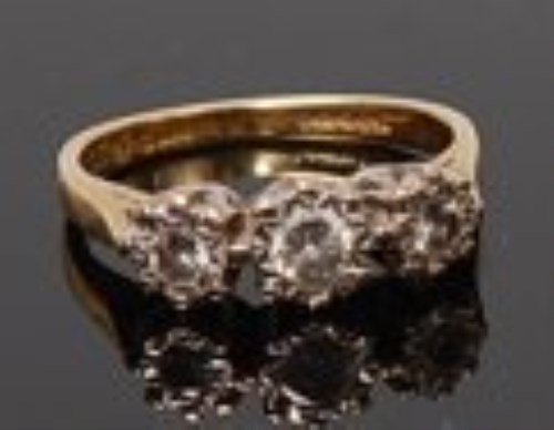 Lot 2001 - An 18ct gold diamond three stone ring, the...