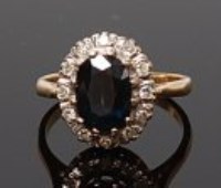 Lot 2002 - An 18ct gold, sapphire and diamond ring,...