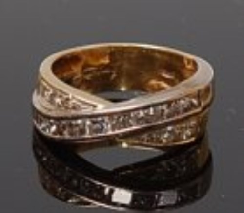 Lot 2003 - An 18ct two-colour gold and diamond crossover...