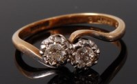 Lot 2053 - An 18ct gold and platinum diamond crossover...