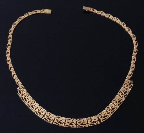 Lot 2057 - A 1970s 9ct gold curblink necklace, of pierced...