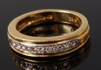 Lot 2063 - An 18ct gold diamond half eternity ring,...