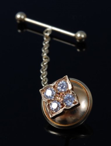 Lot 2071 - An 18ct gold diamond tie pin, the four pavé...