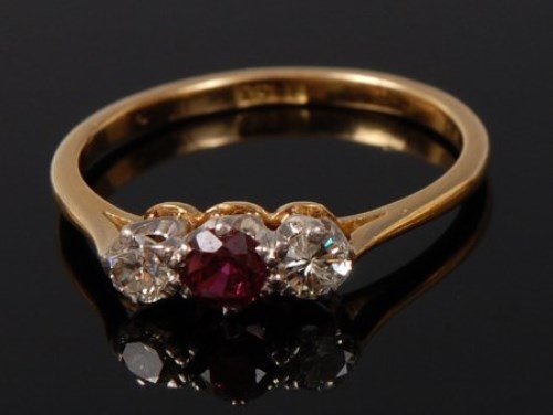 Lot 2076 - An 18ct gold, ruby and diamond three stone...