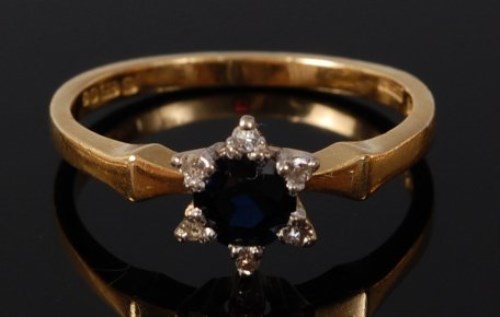 Lot 2077 - A modern 18ct gold, sapphire and diamond ring,...