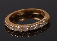 Lot 2083 - An 18ct gold diamond half eternity ring,...