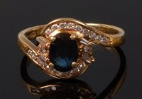 Lot 2085 - A modern 18ct gold sapphire and diamond...