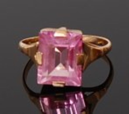 Lot 2030 - A 15ct gold and pink sapphire set dress ring,...