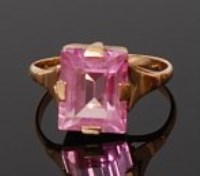 Lot 2030 - A 15ct gold and pink sapphire set dress ring,...