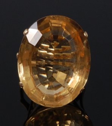 Lot 2089 - A modern yellow metal and citrine dress ring,...