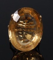 Lot 2089 - A modern yellow metal and citrine dress ring,...