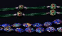 Lot 2093 - An Art Deco beaded glass long necklace,...