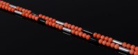 Lot 2094 - An Art Deco beaded coral necklace, having...