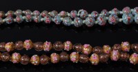 Lot 2095 - A Venetian beaded glass necklace, the pale...