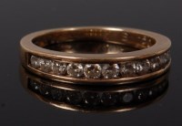 Lot 2102 - A 9ct gold diamond half eternity ring, the...