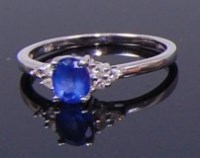 Lot 2119 - A 14ct white gold, blue stone and diamond ring,...