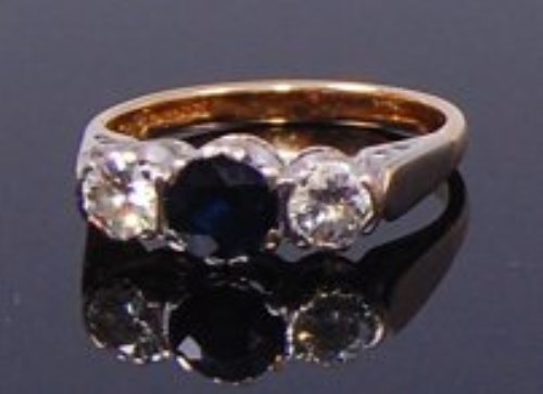 Lot 2120 - An 18ct gold, sapphire and diamond three stone...