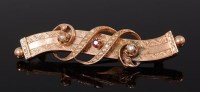 Lot 2140 - A yellow metal, ruby and seed pearl set brooch,...