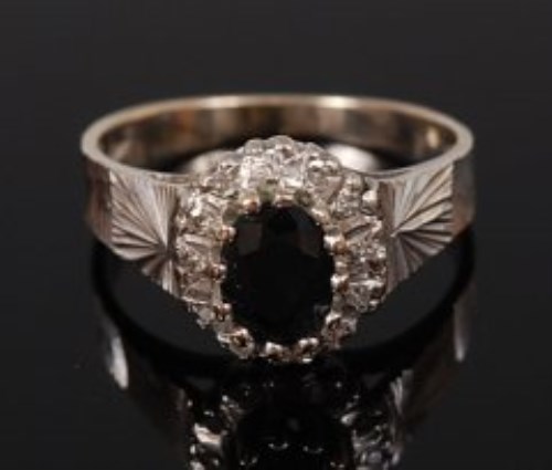 Lot 2145 - An 18ct white gold, sapphire and diamond ring,...