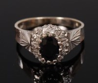 Lot 2145 - An 18ct white gold, sapphire and diamond ring,...