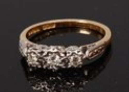 Lot 2154 - An 18ct gold diamond three stone ring,...