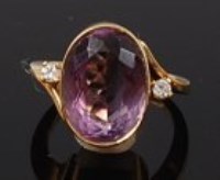 Lot 2156 - An 18ct gold, amethyst and diamond dress ring,...