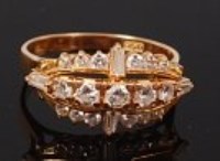 Lot 2173 - A modern 18ct gold diamond set dress ring,...