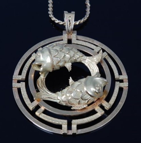 Lot 2181 - A modern 18ct gold Japanese influenced pendant,...