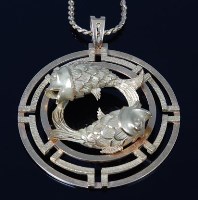 Lot 2181 - A modern 18ct gold Japanese influenced pendant,...