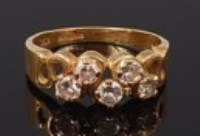 Lot 2188 - A contemporary 18ct gold diamond five stone...