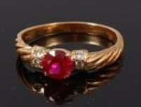 Lot 2203 - A modern 20ct gold, ruby and diamond ring,...