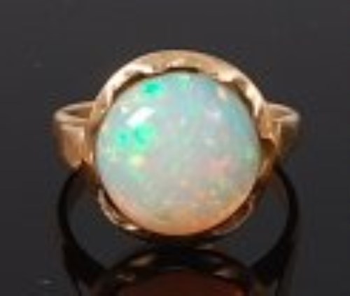 Lot 2204 - A 14ct gold and cabochon opal ring, the single...