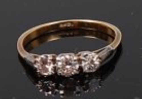 Lot 2207 - An 18ct gold and diamond three stone ring,...