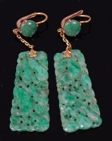 Lot 2214 - A pair of carved celadon jade and yellow metal...