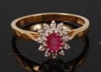 Lot 2218 - An 18ct gold, ruby and diamond flower head...