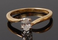 Lot 2044 - An 18ct gold diamond solitaire ring, the claw...