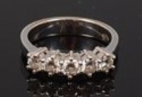 Lot 2226 - An 18ct white gold diamond five stone ring,...