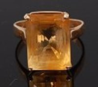 Lot 2233 - A modern 14ct gold citrine set dress ring, the...