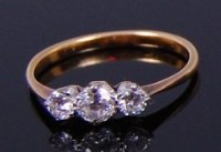 Lot 2241 - An 18ct gold diamond three stone ring,...