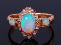 Lot 2243 - A 15ct gold, opal and diamond dress ring,...