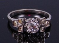 Lot 2244 - A platinum and diamond dress ring, arranged as...