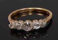 Lot 2259 - An 18ct gold diamond five stone ring, the...