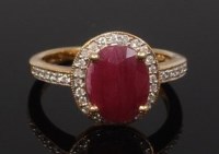 Lot 2262 - A modern 9ct gold, ruby and diamond point set...
