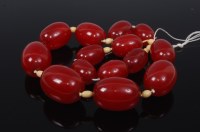 Lot 2267 - A vintage ladies cherry amber beaded necklace,...