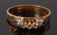 Lot 2047 - A 9ct gold and diamond set band ring, the five...