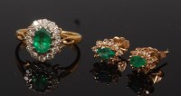 Lot 2274 - An 18ct gold, emerald and diamond cluster ring,...