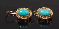 Lot 2277 - A pair of 18ct gold and cabochon turquoise set...