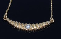 Lot 2285 - An 18ct gold and diamond set pendant on...