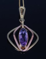 Lot 2286 - A modern 8ct gold and amethyst set pendant,...