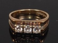 Lot 2289 - A modern 9ct gold and diamond set dress ring,...